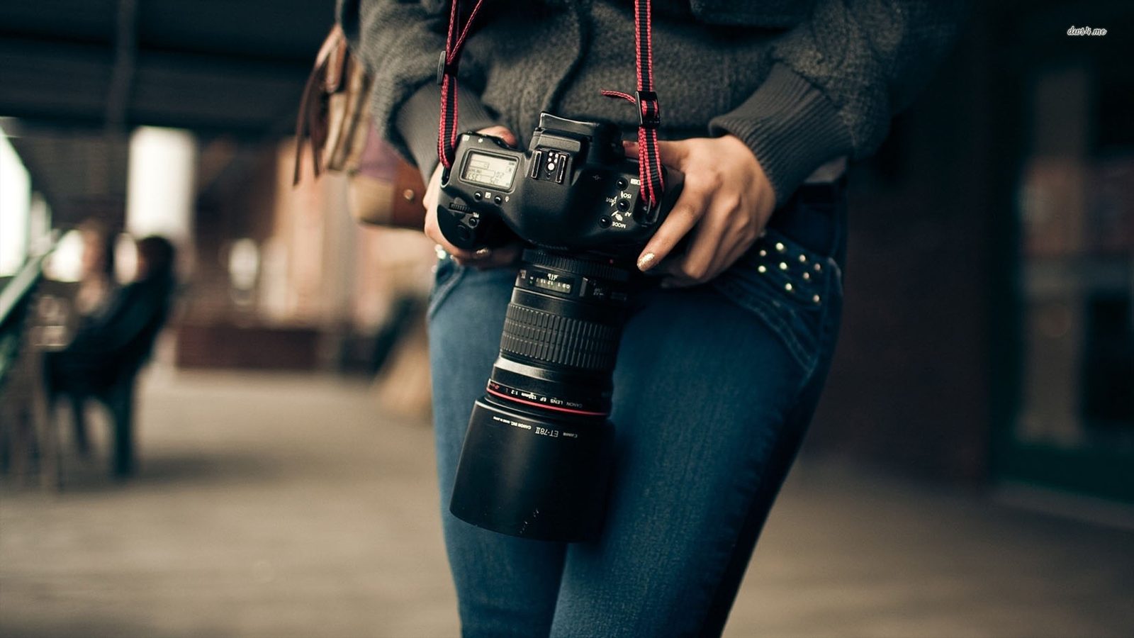 Photographer holding a DSLR camera