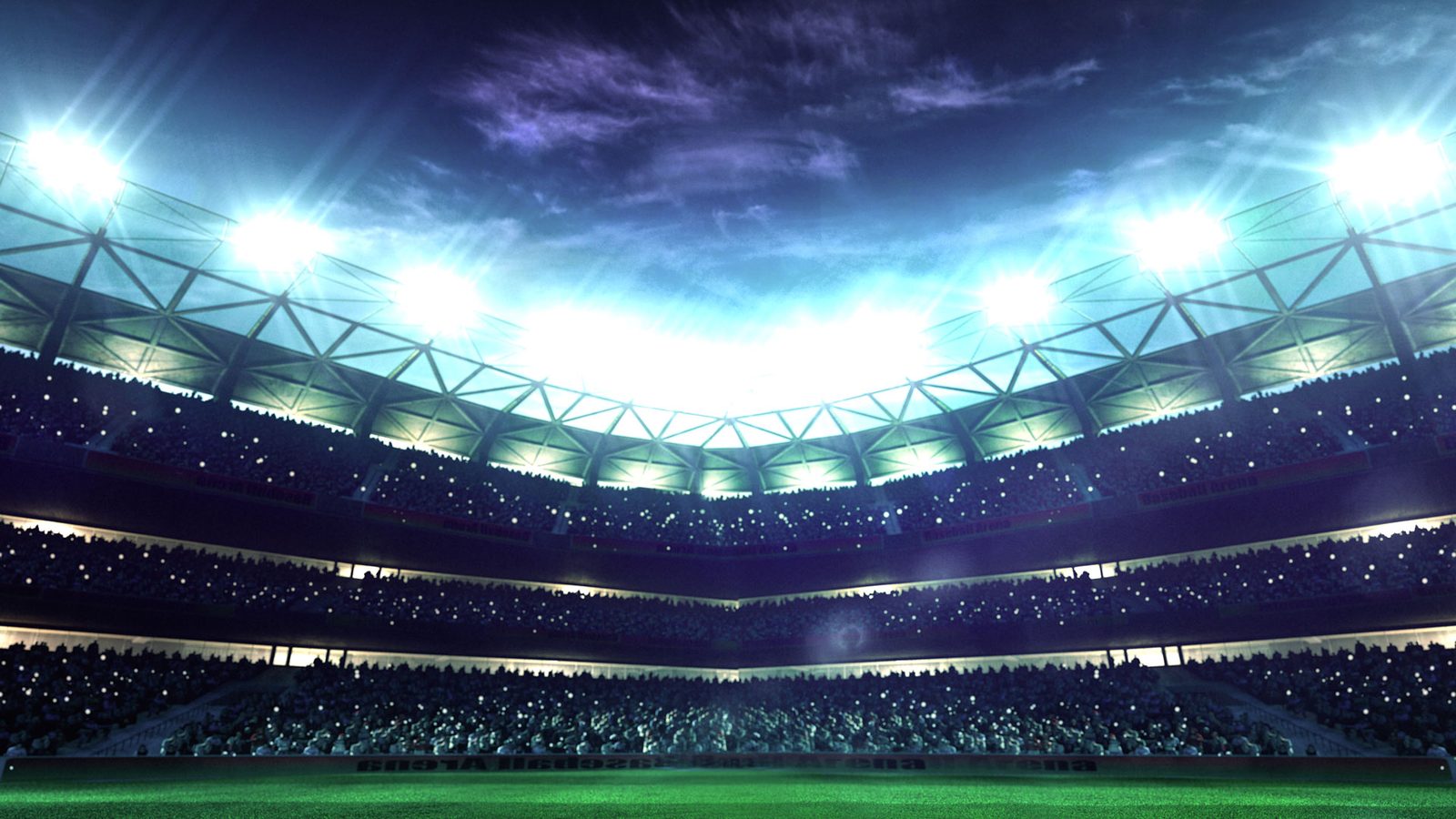Floodlights over a football pitch at night