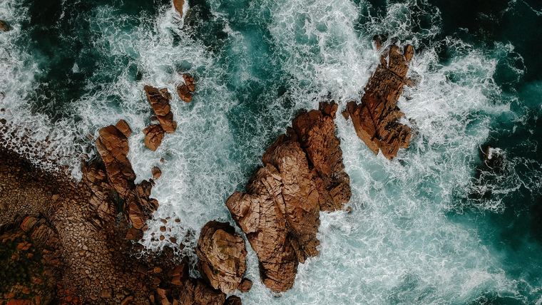 Waves washing over rock pools