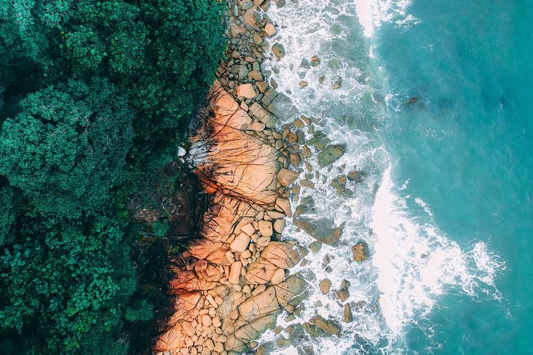 Rocky shoreline over turquoise water