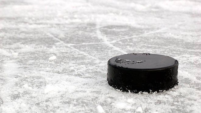 Puck at rest on fresh ice