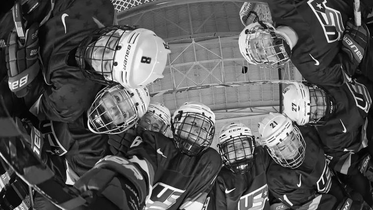 Pre-game huddle seen from the stand above