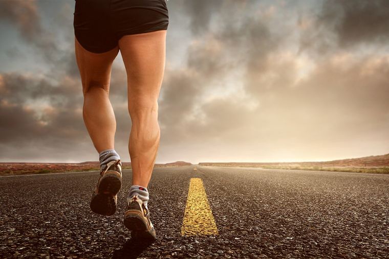 Runner on an empty road at first light